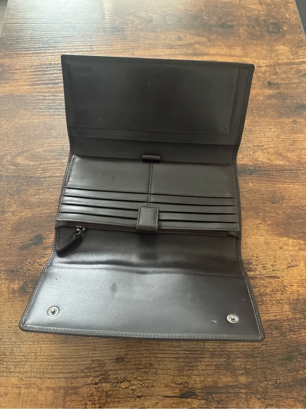 Dark Brown Coach Wallet with lots of card space, never used but has scratch